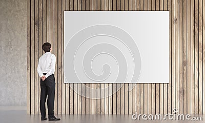 Man looking at poster Stock Photo