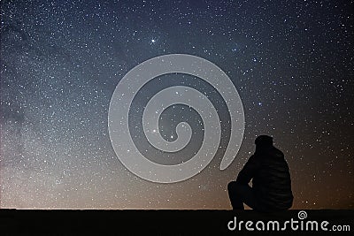 Man looking at the stars Stock Photo