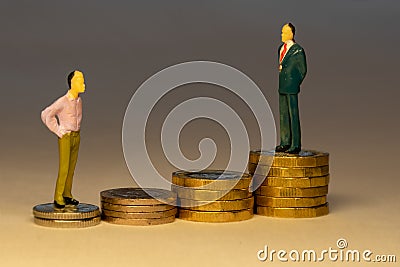 Man looking to business man standing on top of increasing piles of gold coins. Business career concept Stock Photo