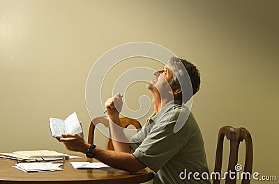 Looking up at heaven asking God for financial help Stock Photo