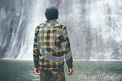 Man looking at waterfall Travel Lifestyle Stock Photo