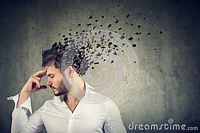 Man losing parts of head as symbol of decreased mind function. Stock Photo