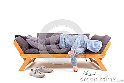 Man lying on couch with hangover. Stock Photo