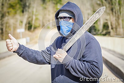 Man with machete try to stop car Stock Photo