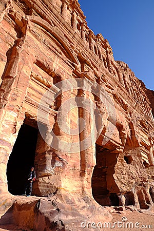 The man-made caves carved in red mountain in Petra - the capital of the Nabatean kingdom in Wadi Musa city at Jordan Editorial Stock Photo