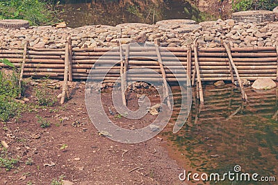 man made weir& x28;small dam& x29; across river Stock Photo