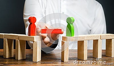 A man makes contact between people opponents. Arbitrator and mediator. Build bridges, seek a compromise in disputes Stock Photo