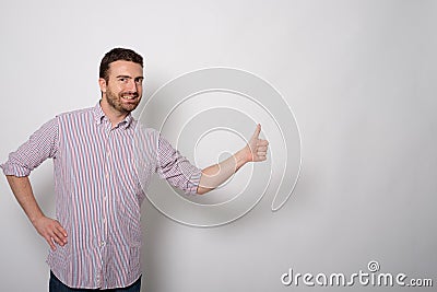 Man makes the gesture of thumbs up Stock Photo