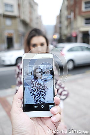 Man makes photos of beautiful woman Stock Photo