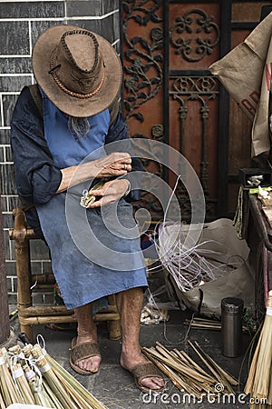 Man making bamboo brush Editorial Stock Photo