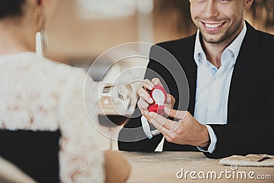 Man Making Marriage Propose to Girl at Restaurent Stock Photo