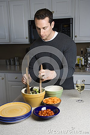 Man making salad. Stock Photo