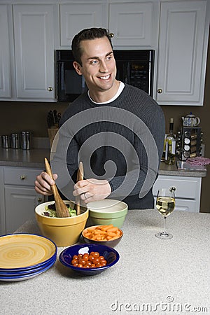Man making salad. Stock Photo