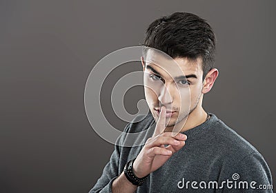 Man making a silence gesture Stock Photo