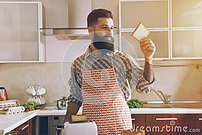 man making toasts for morning breakfast Stock Photo