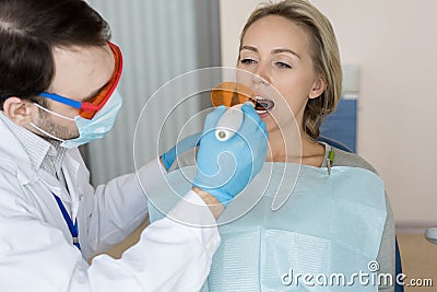 Man making tooth filling Stock Photo