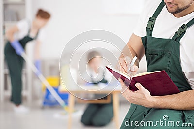 Man managing cleaning crew Stock Photo
