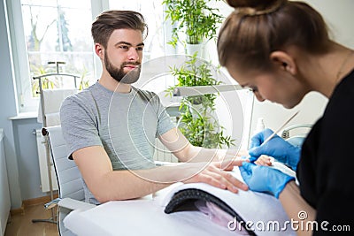 Man during manicure Stock Photo