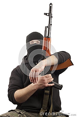 Man in mask with gun Stock Photo