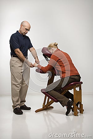 Man massaging woman. Stock Photo