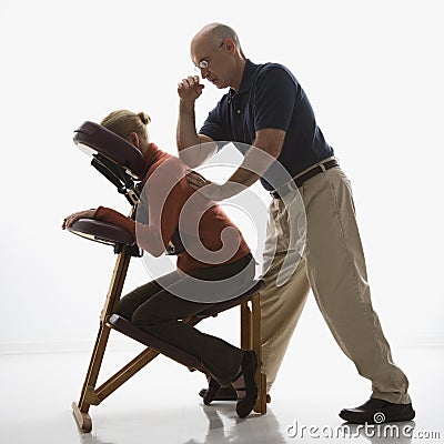 Man massaging woman. Stock Photo