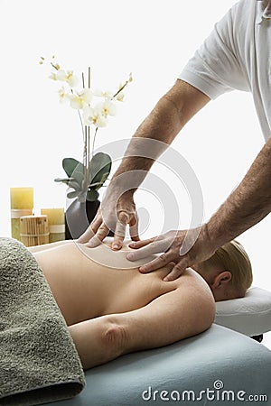 Man massaging woman. Stock Photo