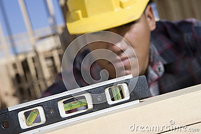 Man Measuring Level Of Wood Stock Photo