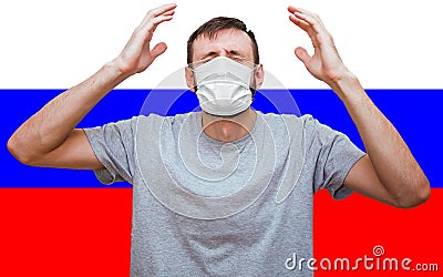 Man with a medical mask on his face raised his hands up in panic and despair Stock Photo