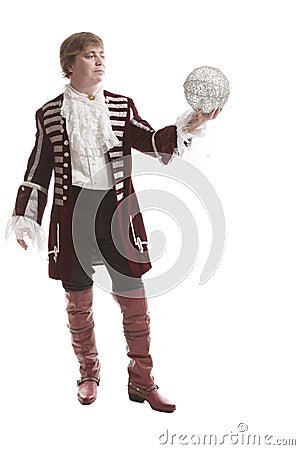 Man in medieval clothes with decorative ball Stock Photo