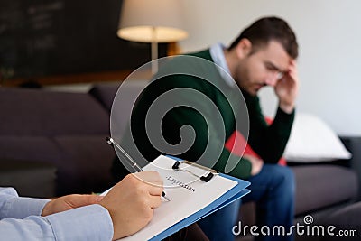 Man with mental health problem in the psychiatrist studio Stock Photo