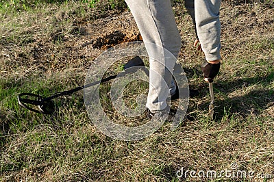 Man with Metal detector looking for a treasure Stock Photo