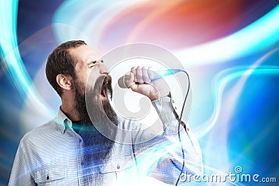 Man with a microphone, abstract background Stock Photo
