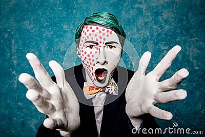 Man mime expresses delight with hands Stock Photo