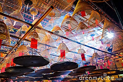 Man Mo Temple, Hollywood Rd, Hong Kong. The amazing coiled incense hung from the ceiling of the temple. Stock Photo