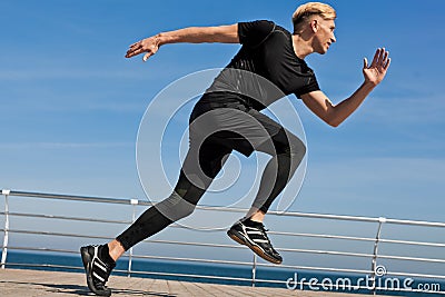 Man in moment of running Stock Photo