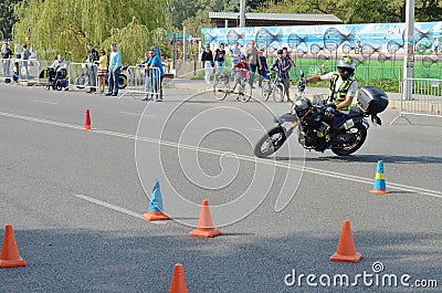 A man motorcycle maneuvers obstacles road Editorial Stock Photo