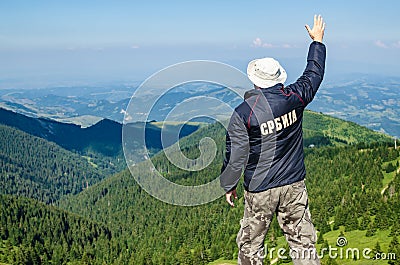 Man on a mountain top. Translation of the text on the jacket: Stock Photo