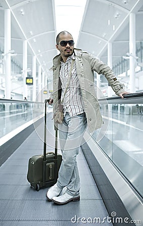 Man on moving walkway Stock Photo