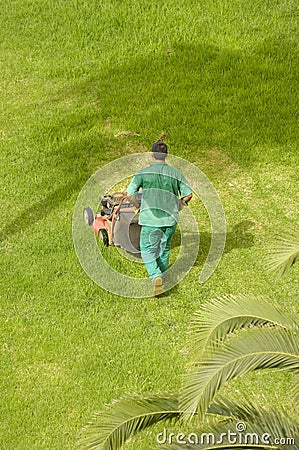 Man mowing grass Stock Photo