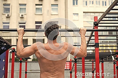Man muscular back athlete doing pull ups with proper form, sport concept Stock Photo