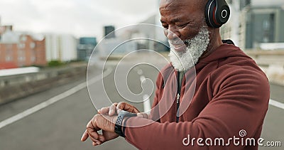 Man, music and smart watch in city for workout, cardio performance and exercise results. Happy senior african runner Stock Photo
