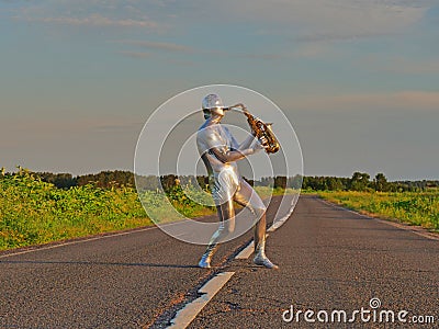 Man musician saxophonist in full body-hugging silver and silver electric suit holding golden alto saxophone, standing on empty Stock Photo