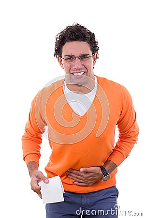 Man in need with stomach problems holding toilet paper in orange Stock Photo