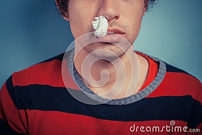 Man with nose bleed and cold sores Stock Photo