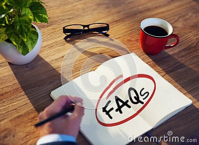 Man with Note Pad and FAQs Concepts Stock Photo