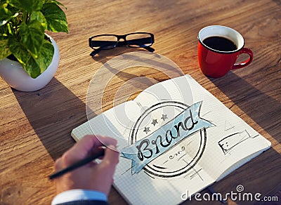 Man with a Note and a Single Word Brand Stock Photo