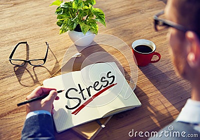 Man with a Note and a Single Word Stress Stock Photo