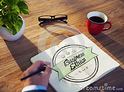 Man and Notepad with Business Ethics Concept Stock Photo