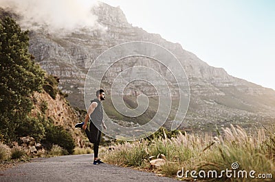 Man is nothing but what he makes of himself. a sporty young man exercising outdoors. Stock Photo
