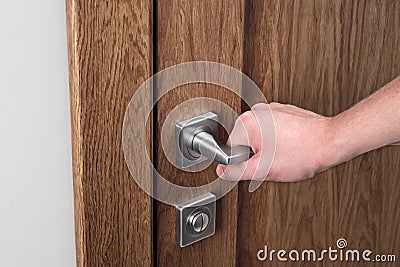 The man opens the door. Close - up of hand and door handle Stock Photo